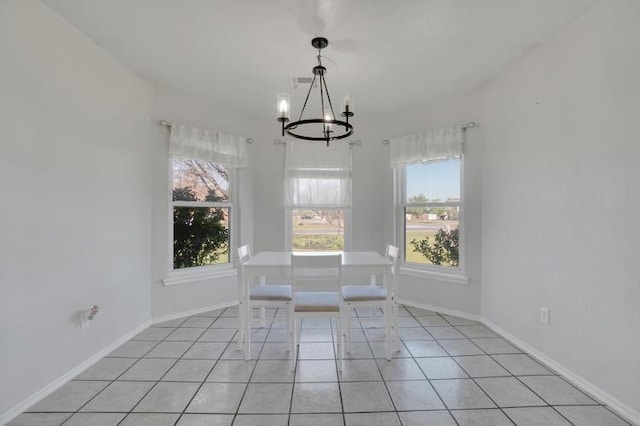 2 NW Havenshire Cir, Lawton, OK 73505 - unfurnished dining area featuring a chandelier, healthy amount of natural light, light tile patterned floors, and baseboards