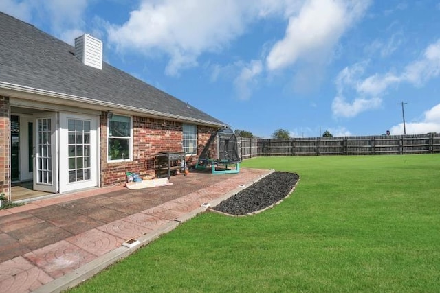 2 NW Havenshire Cir, Lawton, OK 73505 - view of yard featuring a trampoline and a patio