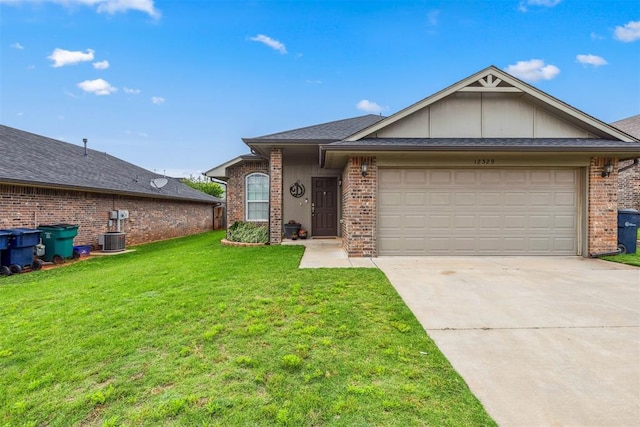 12329 SW 9th Ter, Yukon, OK 73099 - ranch-style home with brick siding, a front lawn, board and batten siding, concrete driveway, and a garage