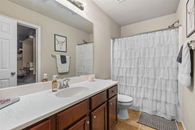 12329 SW 9th Ter, Yukon, OK 73099 - full bath with toilet, vanity, and tile patterned flooring