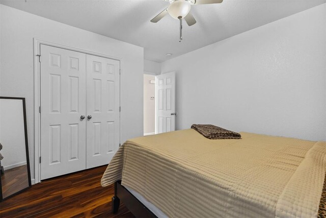 12329 SW 9th Ter, Yukon, OK 73099 - bedroom featuring dark wood-type flooring, a closet, and a ceiling fan
