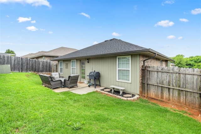 12329 SW 9th Ter, Yukon, OK 73099 - back of house featuring roof with shingles, an outdoor living space, and a patio