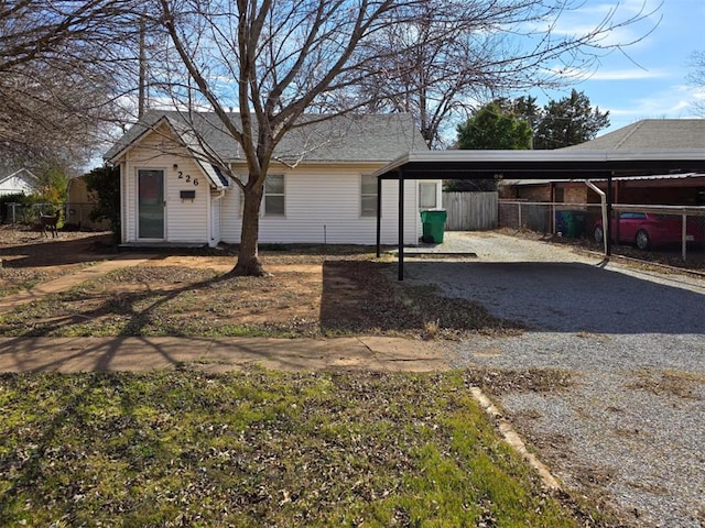 226 E Iowa St, Walters, OK 73572 - view of front of home featuring a carport and driveway