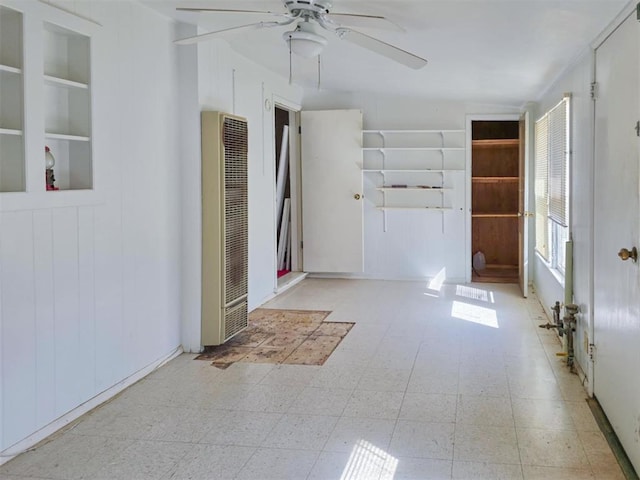 226 E Iowa St, Walters, OK 73572 - empty room featuring a heating unit, tile patterned floors, ceiling fan, and built in features
