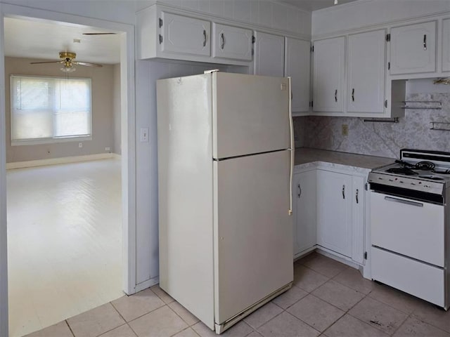 226 E Iowa St, Walters, OK 73572 - kitchen featuring white appliances, ceiling fan, white cabinets, tasteful backsplash, and light tile patterned flooring