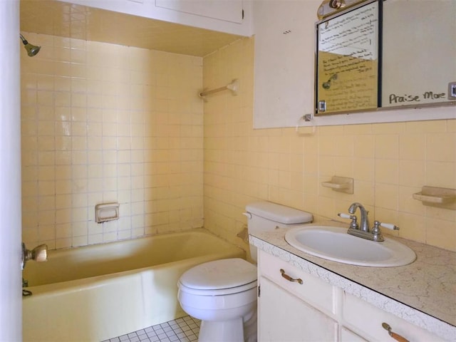 226 E Iowa St, Walters, OK 73572 - full bath with toilet, tile walls, vanity,  shower combination, and tasteful backsplash