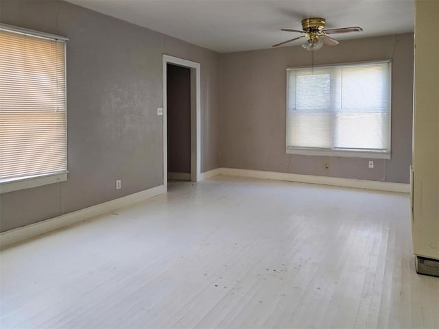 226 E Iowa St, Walters, OK 73572 - spare room with a ceiling fan, wood finished floors, and baseboards