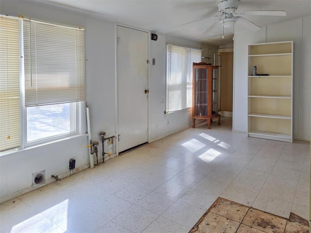 226 E Iowa St, Walters, OK 73572 - spare room featuring ceiling fan, healthy amount of natural light, and built in features