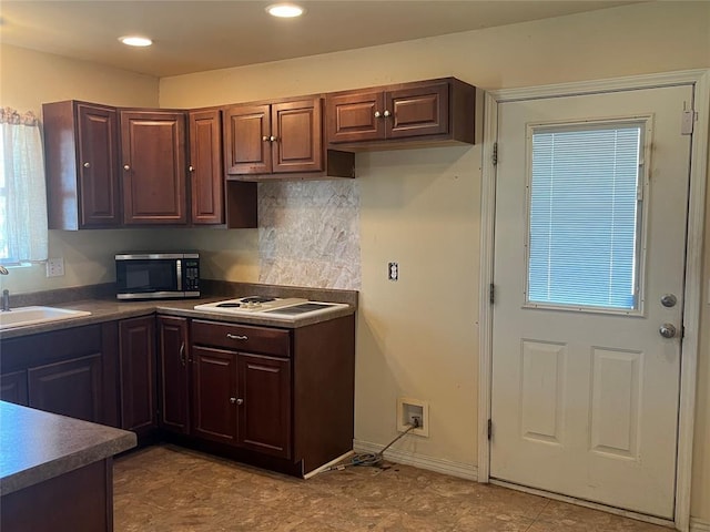 216 N Bk 1600 Rd, Stigler, OK 74462 - kitchen featuring stainless steel microwave, a sink, white cooktop, dark countertops, and recessed lighting