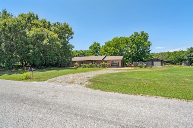 1317 S 58th St, Duncan, OK 73534 - single story home featuring a front yard, driveway, and a detached garage