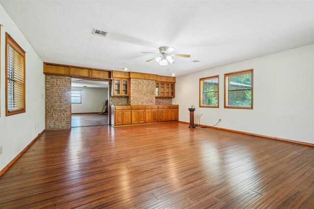 1317 S 58th St, Duncan, OK 73534 - unfurnished living room featuring ceiling fan, wood finished floors, and baseboards