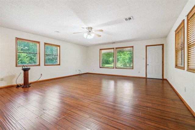 1317 S 58th St, Duncan, OK 73534 - spare room with ceiling fan, healthy amount of natural light, wood-type flooring, and a textured ceiling