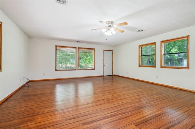 1317 S 58th St, Duncan, OK 73534 - spare room with wood finished floors, ceiling fan, and baseboards