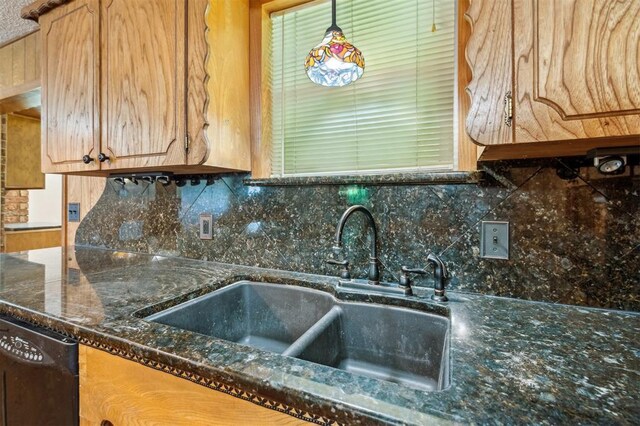 1317 S 58th St, Duncan, OK 73534 - kitchen with a sink, dishwasher, backsplash, and dark stone counters