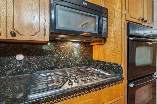 1317 S 58th St, Duncan, OK 73534 - kitchen with black appliances, tasteful backsplash, and brown cabinets