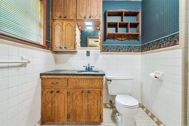 1317 S 58th St, Duncan, OK 73534 - half bath featuring tile walls, toilet, and vanity