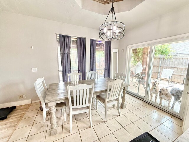 9977 Birkenhead Ct, Yukon, OK 73099 - dining area featuring light tile patterned floors and a chandelier