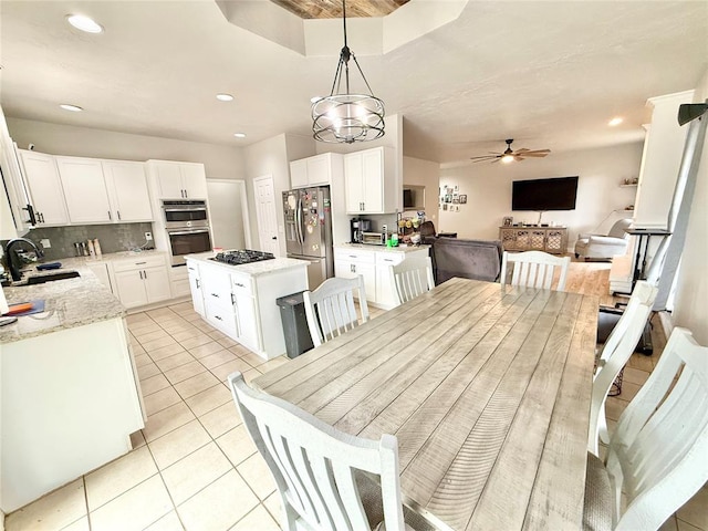 9977 Birkenhead Ct, Yukon, OK 73099 - dining space featuring light tile patterned flooring, a ceiling fan, and recessed lighting