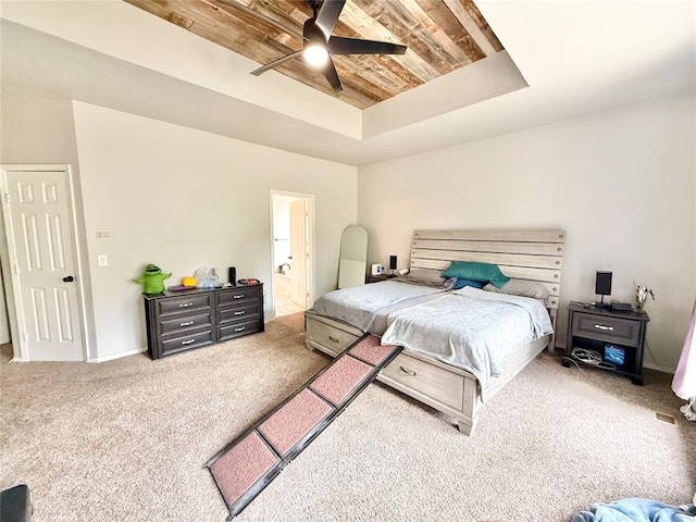 9977 Birkenhead Ct, Yukon, OK 73099 - carpeted bedroom featuring a tray ceiling, wooden ceiling, a ceiling fan, and ensuite bath