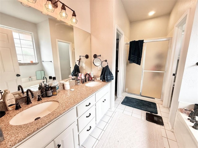 9977 Birkenhead Ct, Yukon, OK 73099 - full bathroom featuring a stall shower, a bath, double vanity, and tile patterned flooring