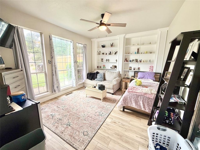 9977 Birkenhead Ct, Yukon, OK 73099 - living area with ceiling fan and wood finished floors