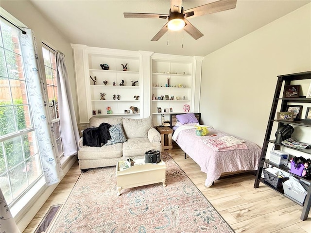 9977 Birkenhead Ct, Yukon, OK 73099 - bedroom featuring light wood-type flooring and ceiling fan
