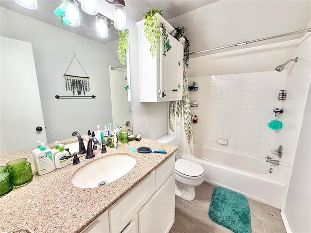 9977 Birkenhead Ct, Yukon, OK 73099 - full bathroom featuring shower / bath combo with shower curtain, vanity, and wood finished floors