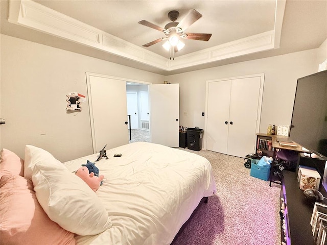 9977 Birkenhead Ct, Yukon, OK 73099 - carpeted bedroom with a raised ceiling, ornamental molding, a closet, and a ceiling fan