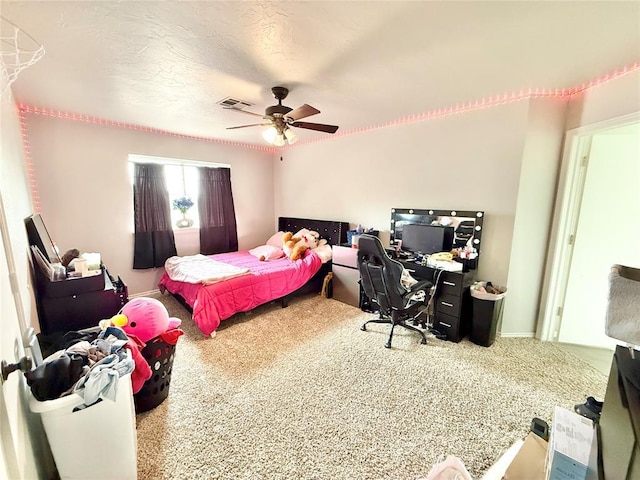 9977 Birkenhead Ct, Yukon, OK 73099 - carpeted bedroom featuring an office area and a ceiling fan