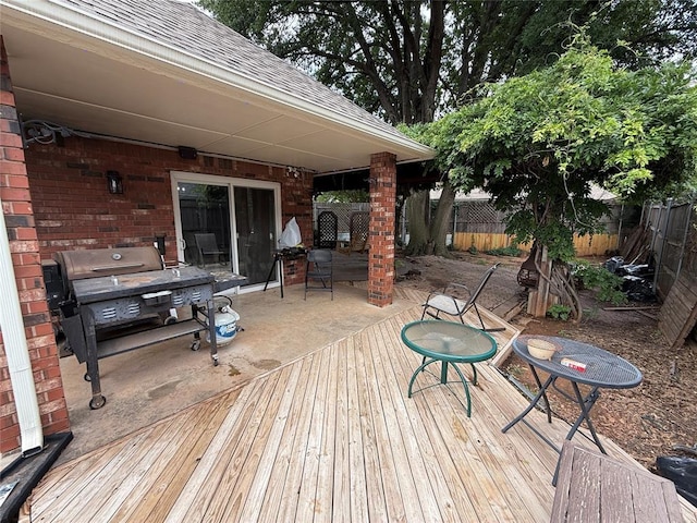 9977 Birkenhead Ct, Yukon, OK 73099 - wooden terrace with a fenced backyard and a patio