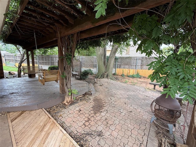 9977 Birkenhead Ct, Yukon, OK 73099 - fenced backyard with a deck and a patio area