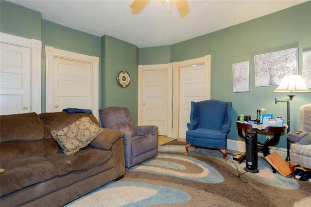 320 W Forest Ave, Eufaula, OK 74432 - carpeted living area with a ceiling fan