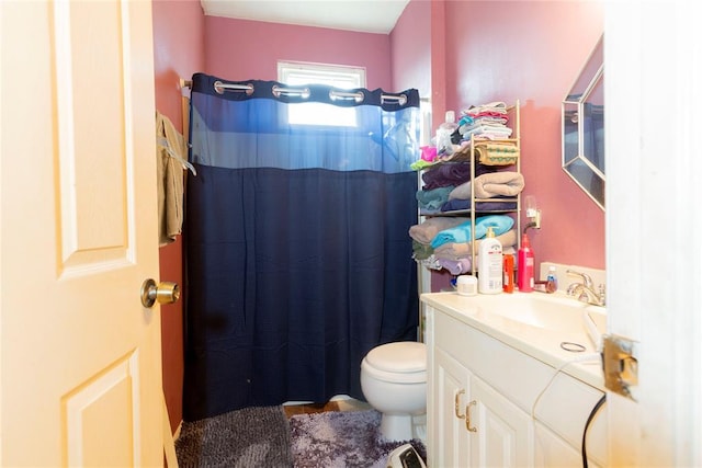 320 W Forest Ave, Eufaula, OK 74432 - bathroom featuring toilet, vanity, and curtained shower
