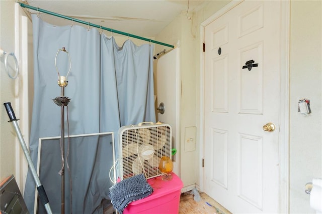 320 W Forest Ave, Eufaula, OK 74432 - full bathroom with a shower with shower curtain and wood finished floors