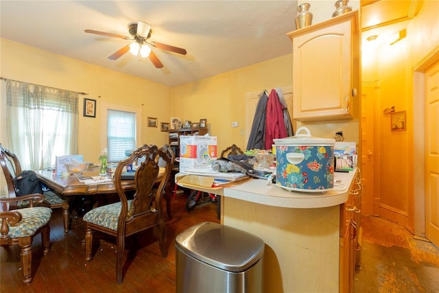 320 W Forest Ave, Eufaula, OK 74432 - dining area with ceiling fan and dark wood-style flooring