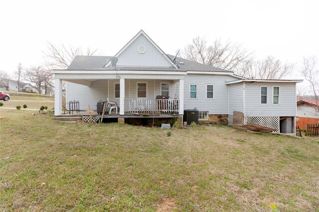 320 W Forest Ave, Eufaula, OK 74432 - back of house with a lawn, covered porch, a shingled roof, and central AC unit