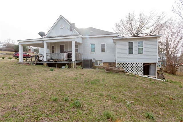 320 W Forest Ave, Eufaula, OK 74432 - back of property featuring central AC unit, a lawn, and a porch