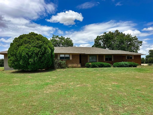 10190 County Road 1310, Fort Cobb, OK 73038 - single story home with a front lawn and brick siding