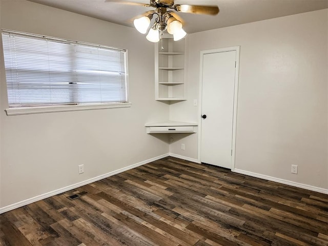 10190 County Road 1310, Fort Cobb, OK 73038 - unfurnished dining area with dark wood-style flooring, ceiling fan, and baseboards