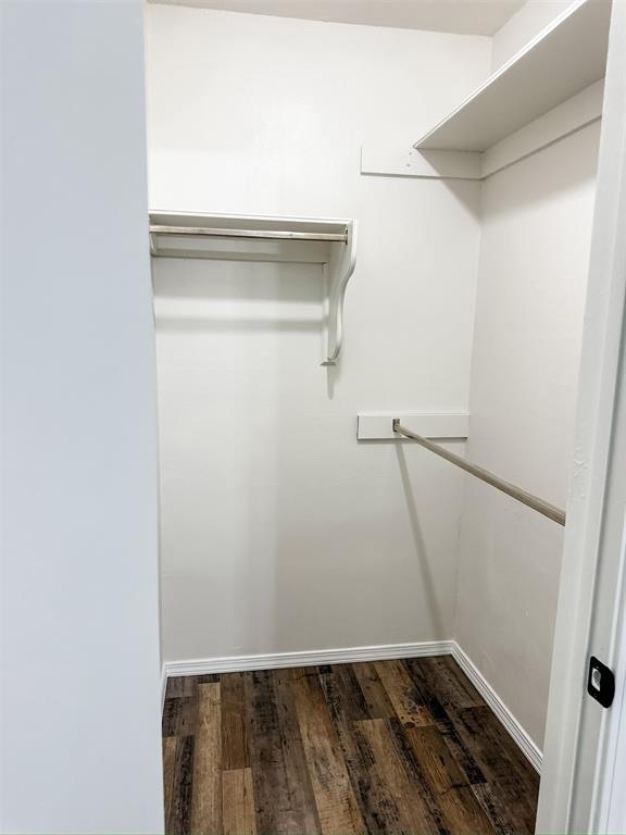 10190 County Road 1310, Fort Cobb, OK 73038 - walk in closet with dark wood-type flooring