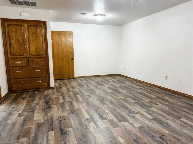 10190 County Road 1310, Fort Cobb, OK 73038 - unfurnished bedroom with dark wood-style flooring and baseboards