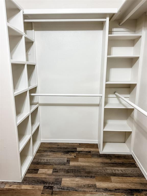10190 County Road 1310, Fort Cobb, OK 73038 - walk in closet with dark wood finished floors