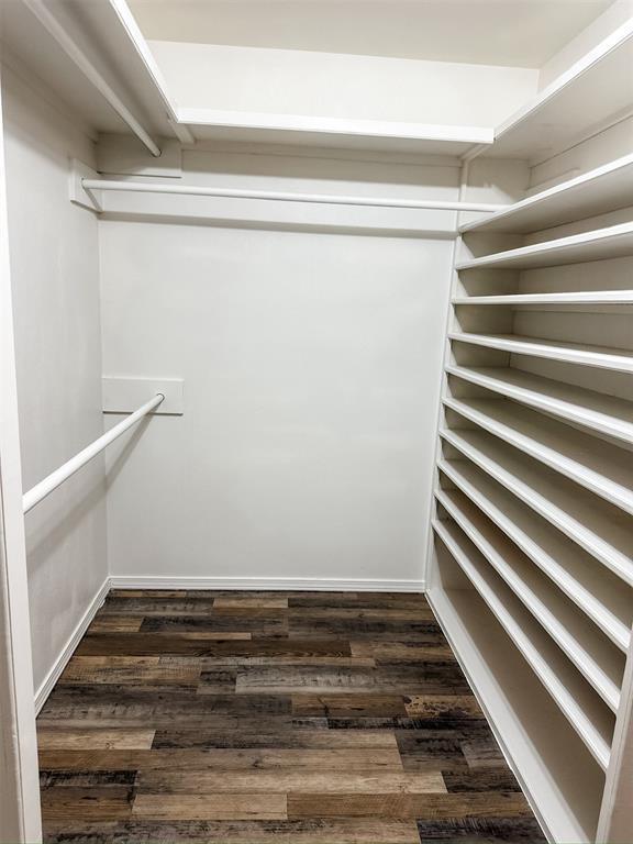10190 County Road 1310, Fort Cobb, OK 73038 - walk in closet with dark wood finished floors