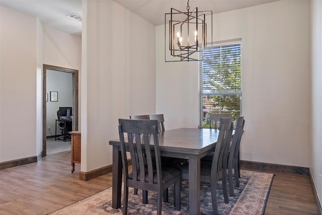 971 County St Unit 2983, Blanchard, OK 73010 - dining space featuring a chandelier, wood finished floors, and baseboards