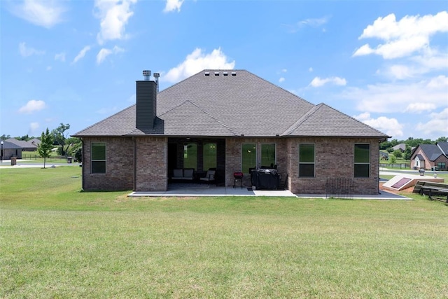 971 County St Unit 2983, Blanchard, OK 73010 - rear view of property with a patio, a yard, a chimney, and brick siding