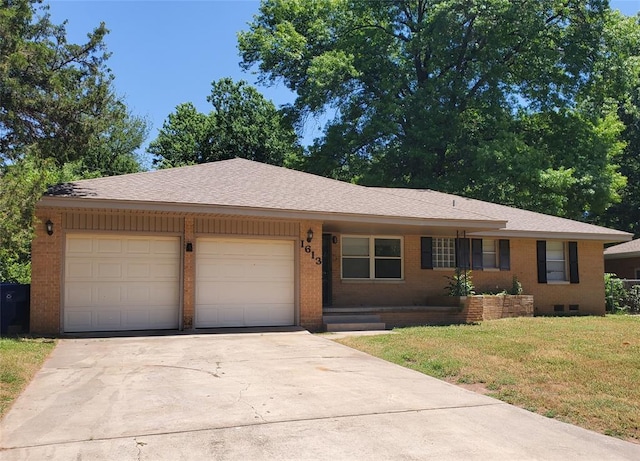 1613 Franklin Dr, Norman, OK 73072 - single story home with brick siding, an attached garage, driveway, and a front lawn