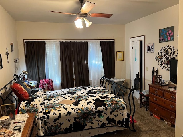 520 S Main St, Wetumka, OK 74883 - bedroom with carpet floors and ceiling fan