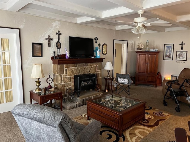 520 S Main St, Wetumka, OK 74883 - living room featuring coffered ceiling, carpet flooring, beamed ceiling, a ceiling fan, and a stone fireplace
