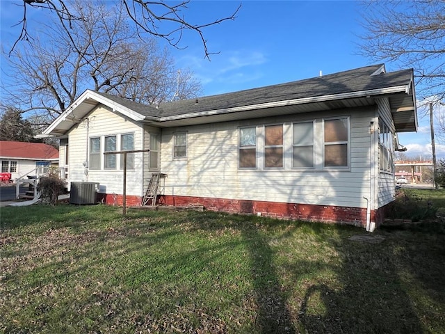 520 S Main St, Wetumka, OK 74883 - back of property featuring central air condition unit, a yard, crawl space, and a shingled roof