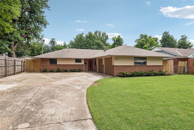 4328 NW 12th St, Oklahoma City, OK 73107 - single story home with brick siding, concrete driveway, a gate, and an attached garage